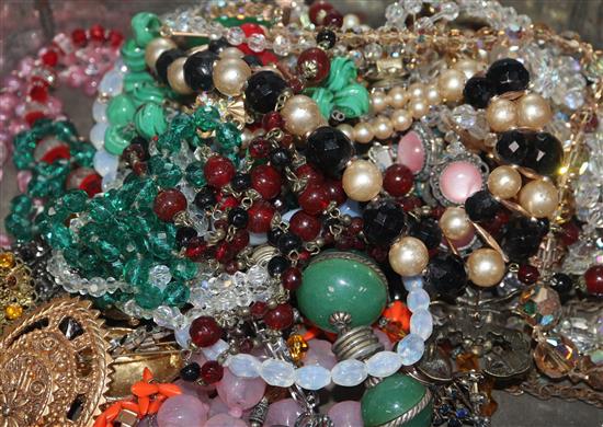 A box of assorted costume jewellery, including necklaces.